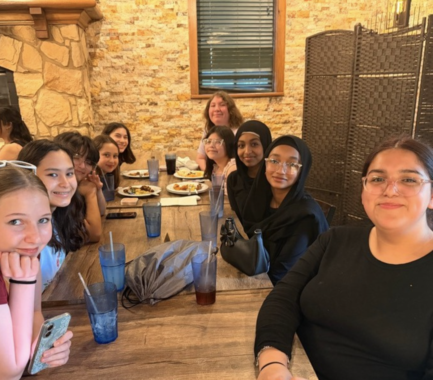The YWLA Speech & Debate team celebrating together